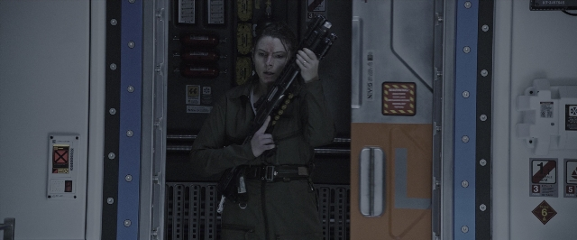 Wide shot frame from Alien: Covenant — standing, room, door
