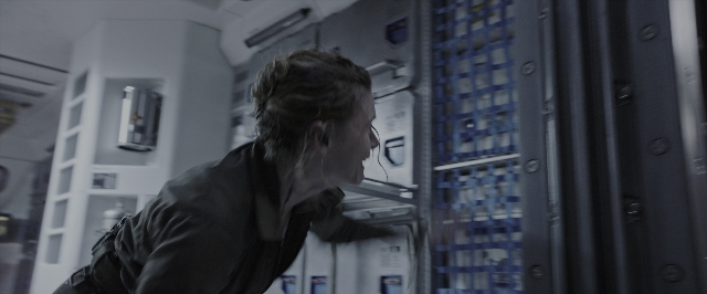 Wide shot frame from Alien: Covenant — standing, room, face