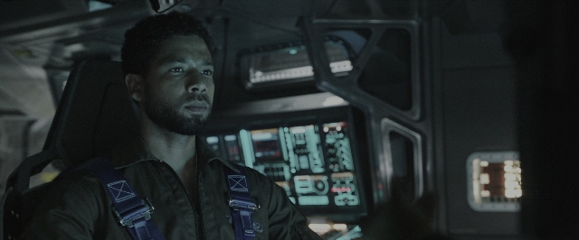 Wide shot frame from Alien: Covenant — sitting, face, boat
