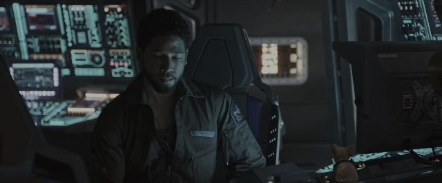 Wide shot frame from Alien: Covenant — sitting, night, face