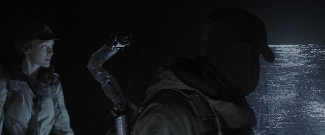 Wide shot frame from Alien: Covenant — standing, room, hat
