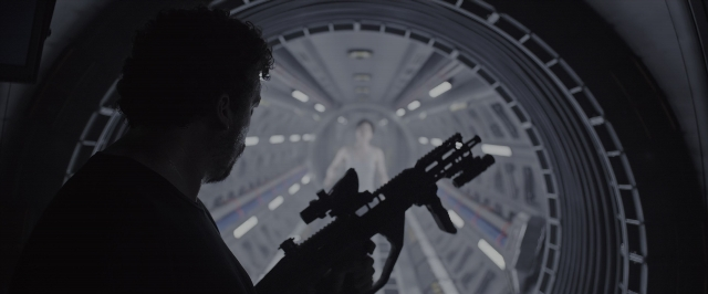 Wide shot frame from Alien: Covenant — standing, hand, shirt