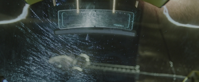 Wide shot frame from Alien: Covenant — car, glass, window