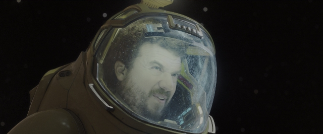 Wide shot frame from Alien: Covenant — hat, suit, beard