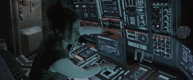 Wide shot frame from Alien: Covenant — sitting, room, shirt