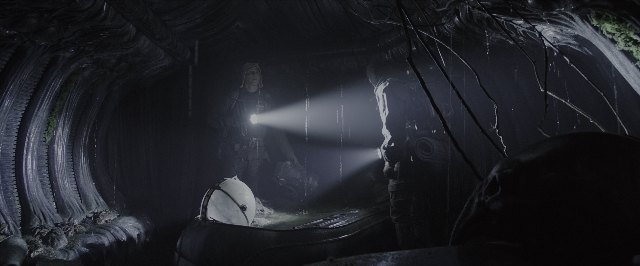 Wide shot frame from Alien: Covenant — standing, hat, water