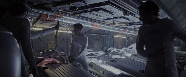 Wide shot frame from Alien: Covenant — standing, room, table