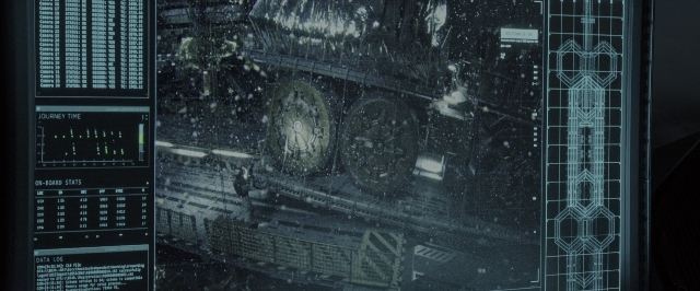 Wide shot frame from Alien: Covenant — face, clock, window