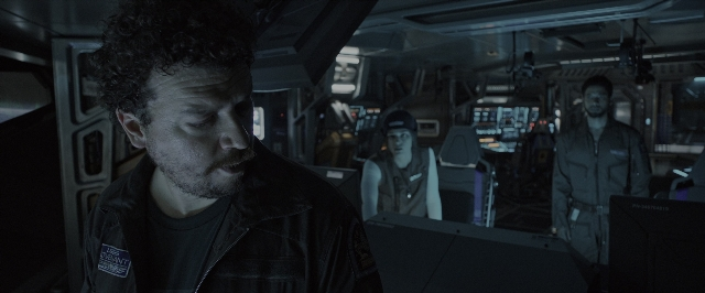 Wide shot frame from Alien: Covenant — standing, room, uniform