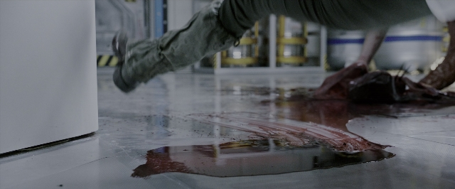 Wide shot frame from Alien: Covenant — room, person, footwear