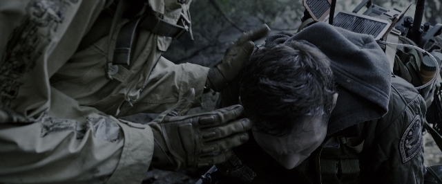 Wide shot frame from Alien: Covenant — hat, gun, person