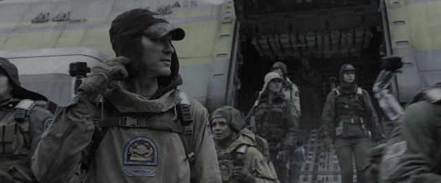 Wide shot frame from Alien: Covenant — standing, door, hand