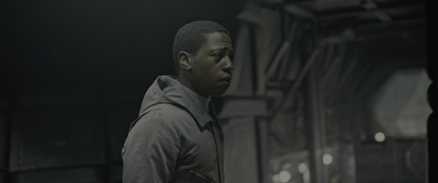 Frame from Alien: Romulus — standing, room, dialogue