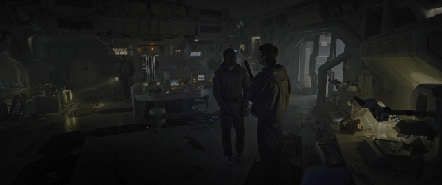 Wide shot frame from Alien: Romulus — standing, room, dialogue
