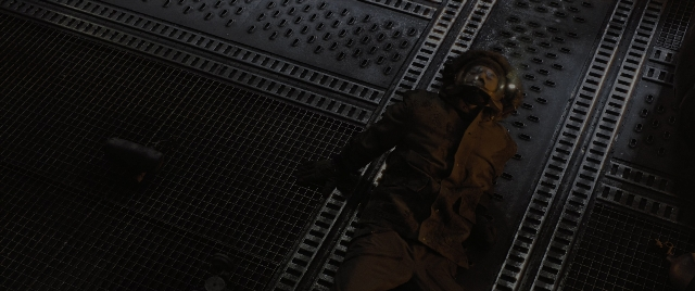 Wide shot frame from Alien: Romulus — walking, room, person