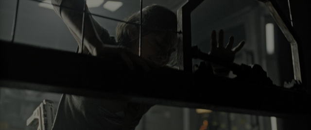 Wide shot frame from Alien: Romulus — standing, face, person