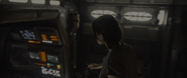 Wide shot frame from Alien: Romulus — standing, room, shirt