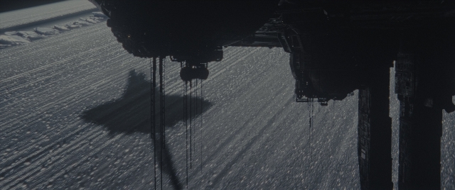 Wide shot frame from Alien: Romulus — car, boat, snow