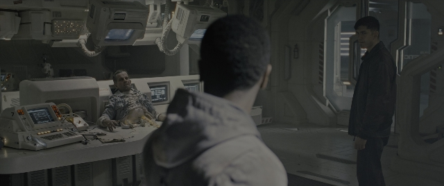 Wide shot frame from Alien: Romulus — sitting, standing, room