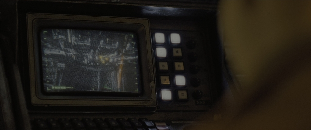 Wide shot frame from Alien: Romulus — computer keyboard