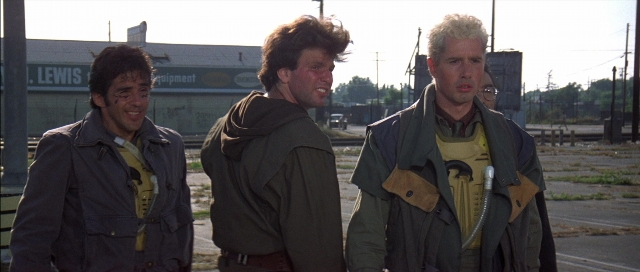 Wide shot frame from The Adventures of Buckaroo Banzai Across the 8th Dimension — standing, street, shirt