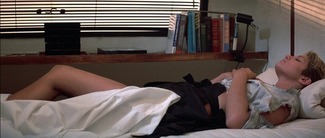 Frame from The Adventures of Buckaroo Banzai Across the 8th Dimension — book, room, bed