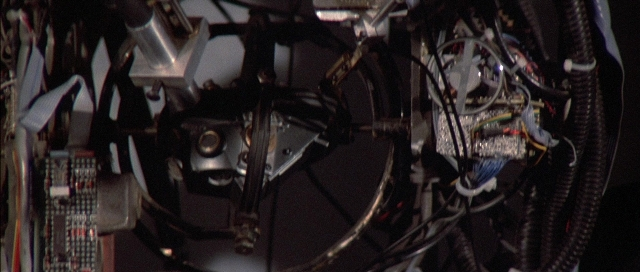 Wide shot frame from The Adventures of Buckaroo Banzai Across the 8th Dimension — bicycle