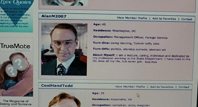 Frame from Burn After Reading — suit, tie, face