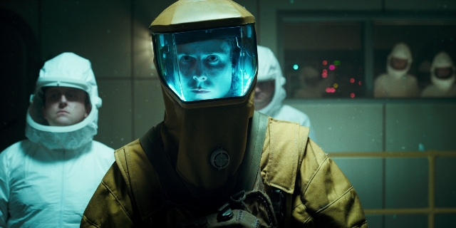 Wide shot frame from Stranger Things — standing, hat, suit