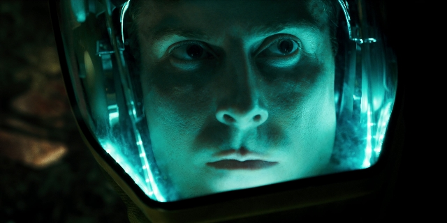 Frame from Stranger Things — hat, suit, face