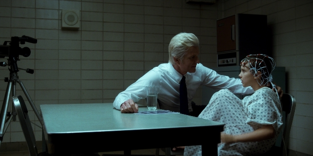 Wide shot frame from Stranger Things — sitting, room, table