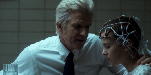 Wide shot frame from Stranger Things — kitchen, tie, shirt