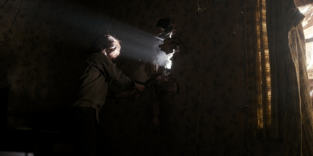 Wide shot frame from Stranger Things — standing, room, dialogue
