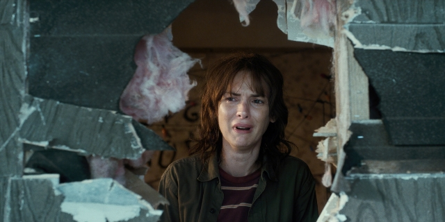 Wide shot frame from Stranger Things — standing, shirt, face