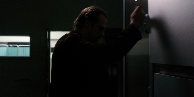Frame from Stranger Things — standing, room, door