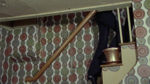Wide shot frame from Female Trouble — walking, person, footwear
