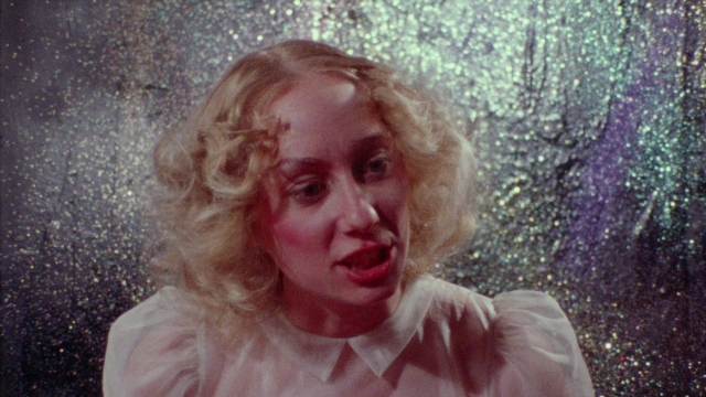 Wide shot frame from Female Trouble — people, action, show