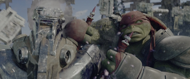 Wide shot frame from Teenage Mutant Ninja Turtles: Out of the Shadows — standing, hand, gun