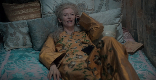 Wide shot frame from Only Lovers Left Alive — book, dialogue, bed