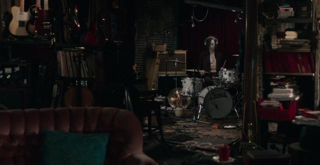 Wide shot frame from Only Lovers Left Alive — room, hand, guitar