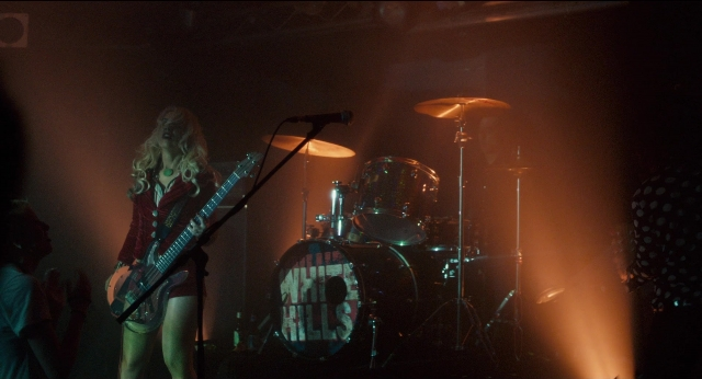 Wide shot frame from Only Lovers Left Alive — shirt, microphone, hair