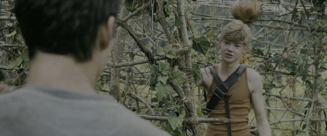 Wide shot frame from The Maze Runner — standing, face, hair