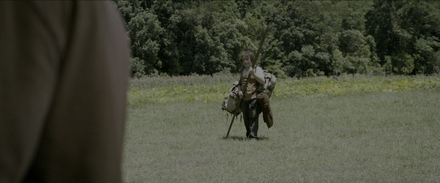 Wide shot frame from The Maze Runner — people, walking, ride