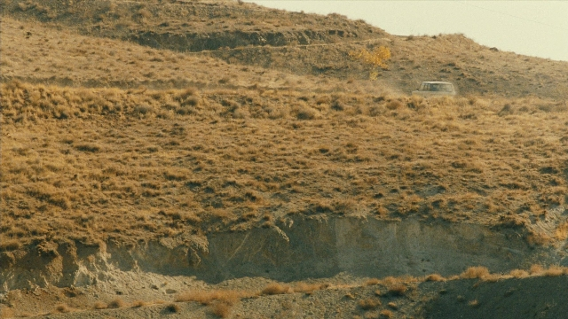 Frame from Ta'm e guilass — street, car, land vehicle