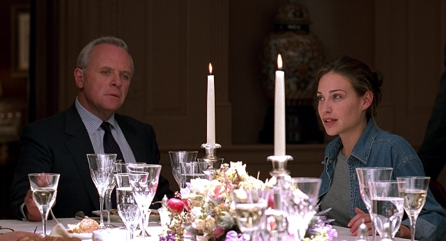 Wide shot frame from Meet Joe Black — sitting, table, mirror