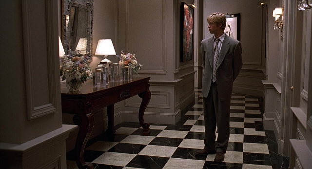 Wide shot frame from Meet Joe Black — standing, table, mirror