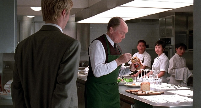 Wide shot frame from Meet Joe Black — dialogue, kitchen, shirt