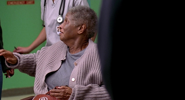 Wide shot frame from Meet Joe Black — sitting, standing, shirt
