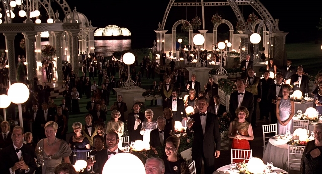 Wide shot frame from Meet Joe Black — table, night, person