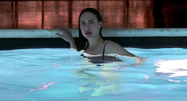 Wide shot frame from Meet Joe Black — standing, water, face